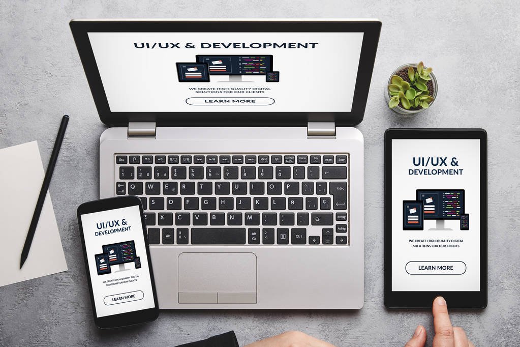 UI/UX design and development concept on laptop, tablet and smart