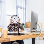 Man holding clock