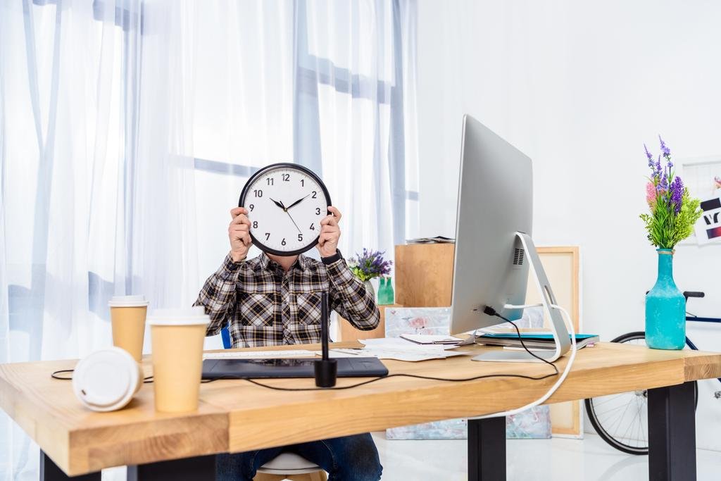 Man holding clock